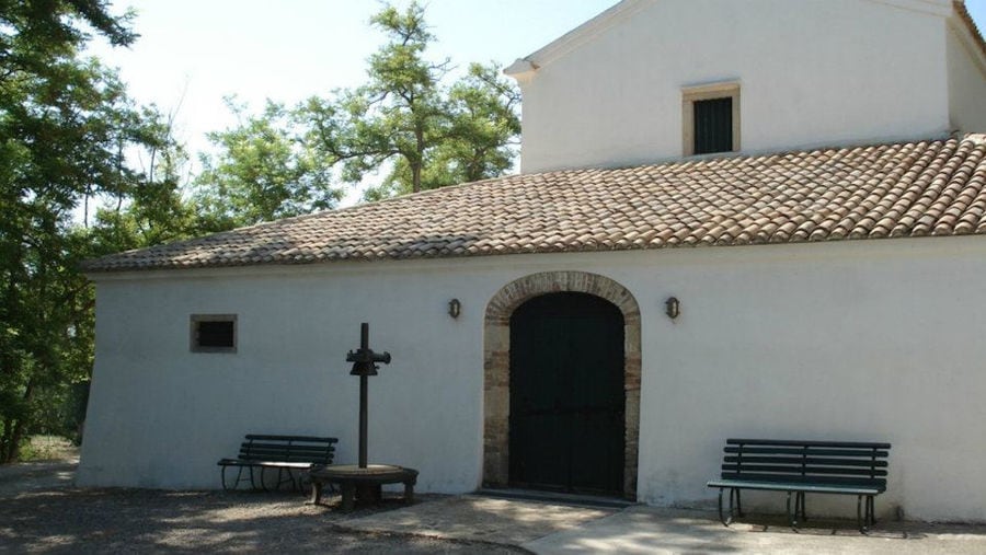 'Theotoky Estate' entrance with two wood benches on the both sides